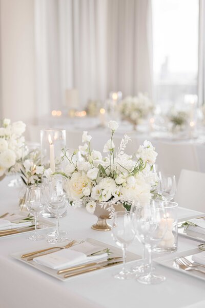 White rose centerpieces on table