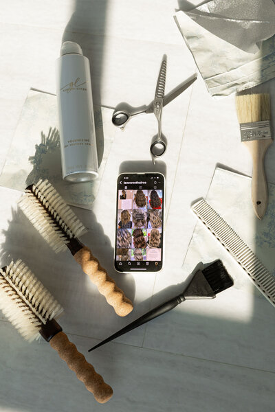 flatlay of styling products and tools