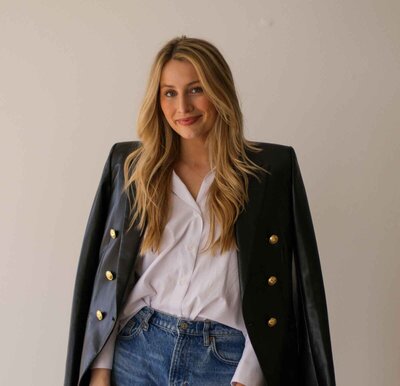 Merrit Elizabeth wearing a blazer ready to meet new eating disorder recovery coaching clients