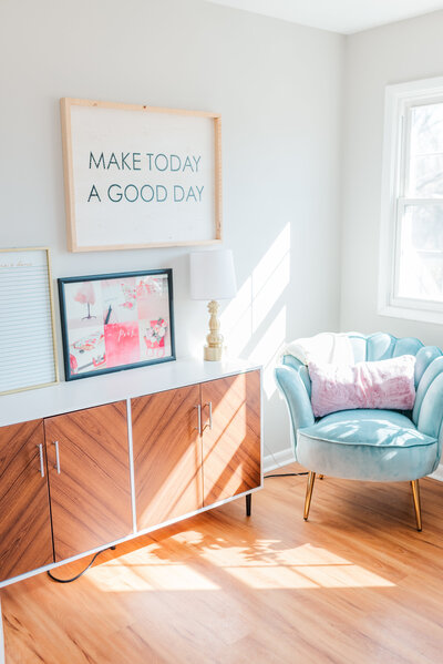 office with light blue chair and a frame that says Make Today a Good Day