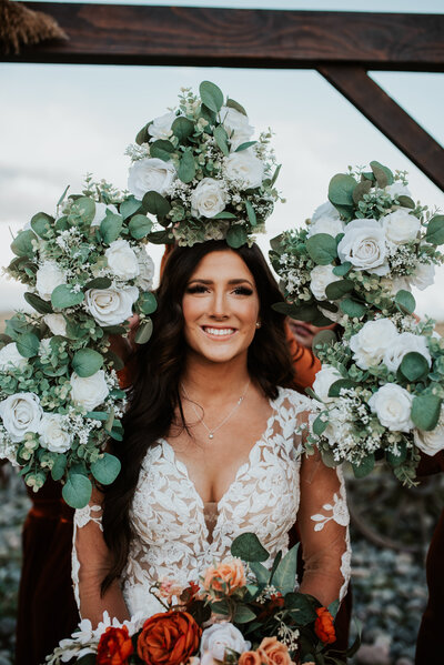 beautiful bride surrounded by flowers at her Idaho wedding