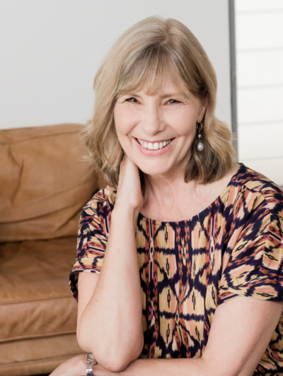 Karen Skinner sitting and smiling | Brand By Design
