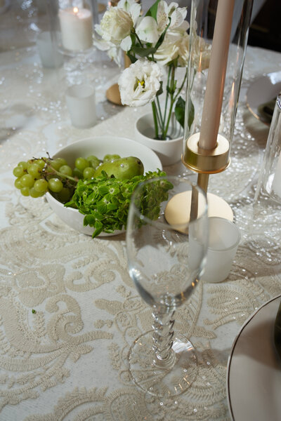 table scape with candles flowers and a wine glass