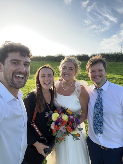 Amy & Nick posing with couple