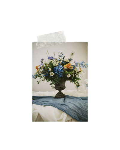 Large floral arrangement on a table, representing events and planning services for Oregon weddings offered by Birdie June. 