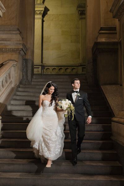 Elegant editorial-style bridal portrait captured on the steps of Philadelphia City Hall
