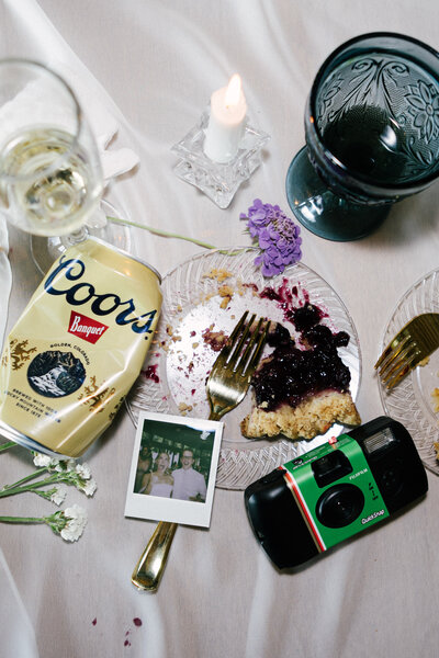 Tattooed couple sharing a candid moment during their alternative wedding in Springfield, MO, photographed by Chelsea Stanford.