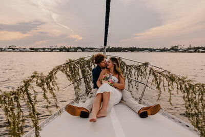 Couple shares intimate moment on their sunset gulf shores elopement at the beach