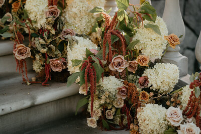 Close up of ceremony  wedding flowers roses, hydrangeas, amaranthus, dried hops