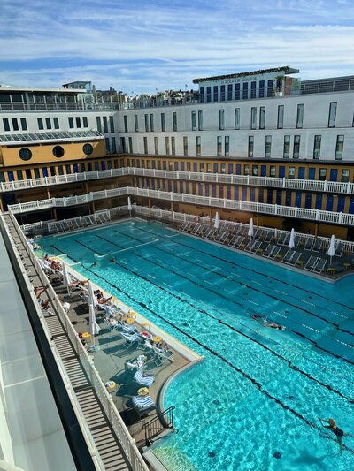Photo of Outside Pool Surrounded by Buildings