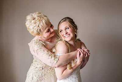Mother of the bride and bride hugging in Seattle Wedding photo