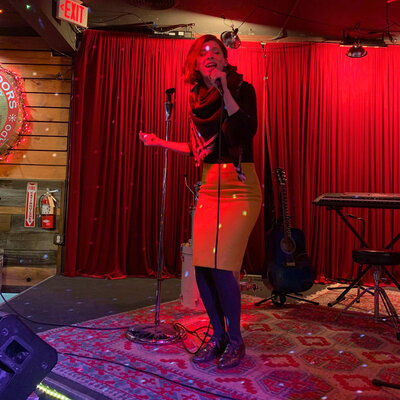 Ashley Laabs singing on stage