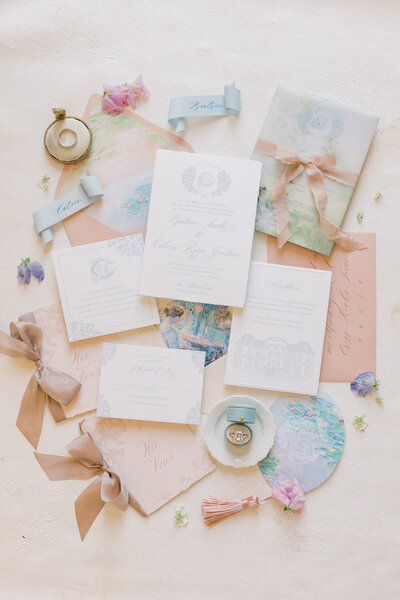 elegant-wedding-invitations-rings-and-stationery-on-soft-background