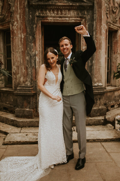 Happy couple at tropical resort for wedding photos