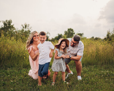 Family running through a field