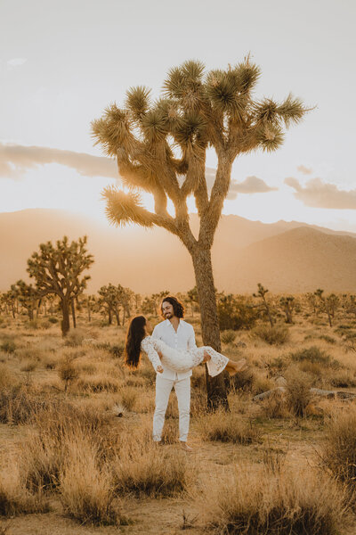 A newly engaged couple kiss and dip in portrait session with Mattie ONeill Photography