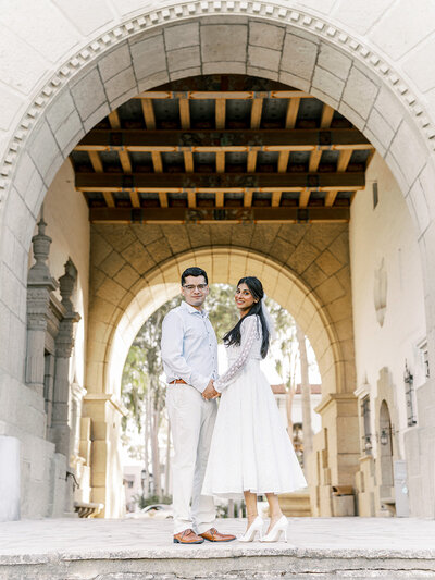 Santa Barbara engagement photography captured under the beautiful arches by Leana Myra Photography.
