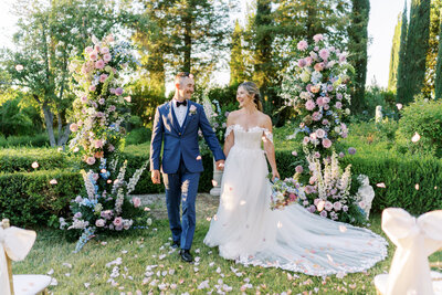 bride and groom holding hands during wedding ceremony