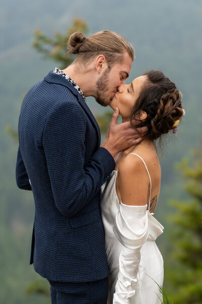A couple shares a first kiss at their Yosemite elopement