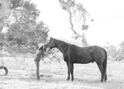 Western cowgirl and her bareback horse portrait