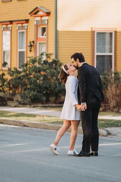 A couple stop and kiss in the town of Chester. 