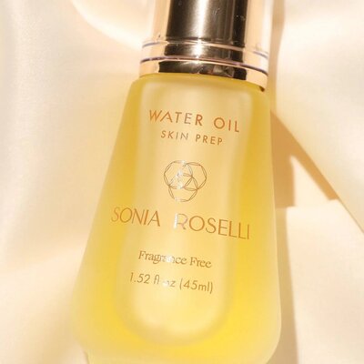 A glass bottle of Water Oil from Sonia Roselli Beauty