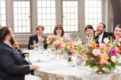 Wedding party celebrating with bouquets featuring garden flowers as centerpieces