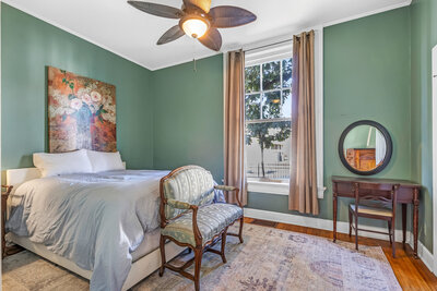 staged bedroom with green walls