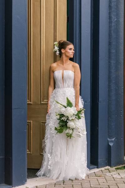 a bride in a timeless pose staring off into the distance before her wedding in louisville, ky