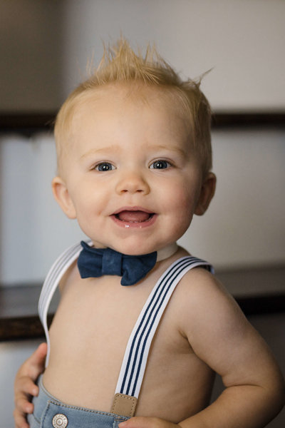 Dapper baby wearing suspenders