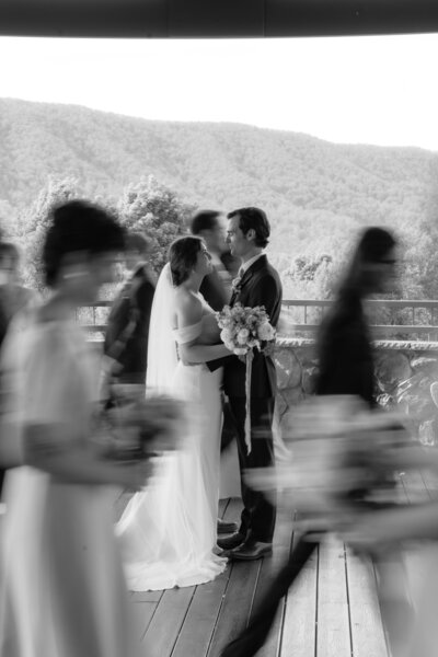 photo taken by wedding photographer in virginia of bride and groom surrounded by wedding party