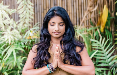 Mindfulness coach Radhika meditating outside