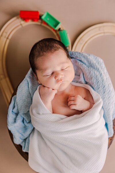 Sweet newborn baby peacefully sleeping during a lifestyle session in Harrisonburg, VA