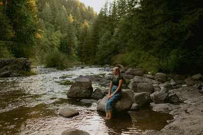 girl standing in river at washington nature park