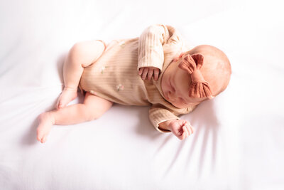 university place newborn photos of baby girl with pink bow