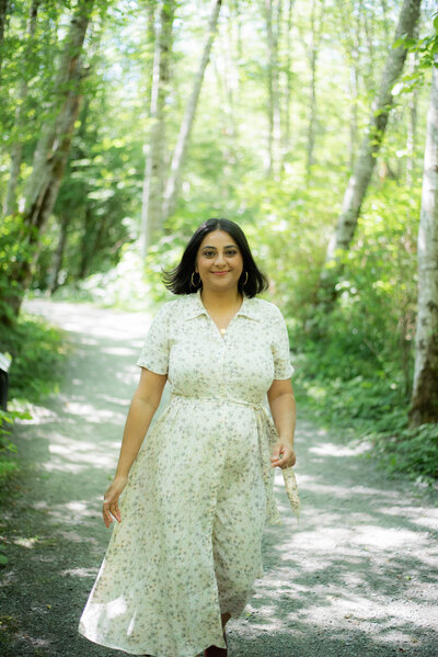 Parm Nizher therapist and healer walking through woods