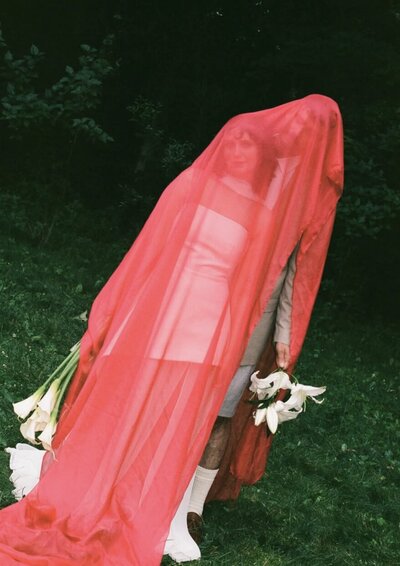 bride-groom-under-red-veil-meg-pearson-photography