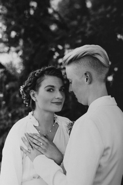 B & W of couple standing together touching hands, Unique Melody Events & Design (New England wedding planners helped with this wedding