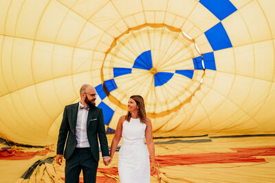 bride and groom standing inside a hot air balloon in sedona az for their elopement