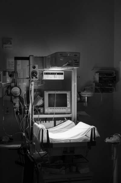 Infant warmer stands by in operating room