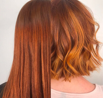 Image of client with red hair that has been cut from long to short and styled with bouncy waves.