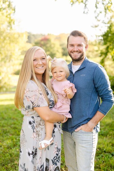 wedding photographer minneapolis mn and her family smiling at the camera