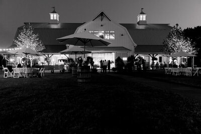Black and white exterior photo of the Wildflower On Watts venue at nighttime