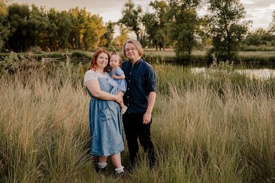 Parents swing their son during their Fort Collins Family Portrait PhotoSession