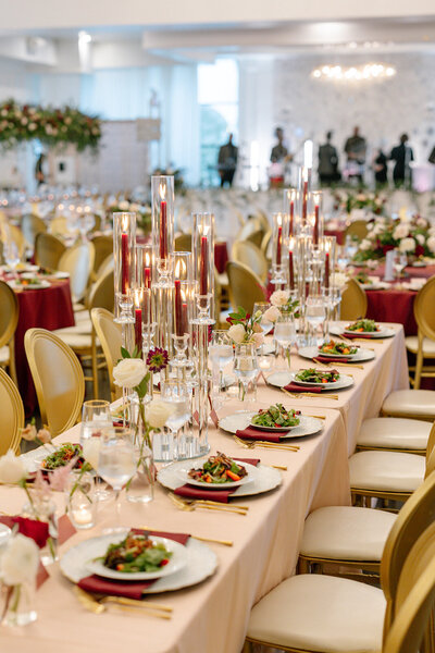 Elegant Houston wedding reception with pink florals and gold accents by Westmore Events.