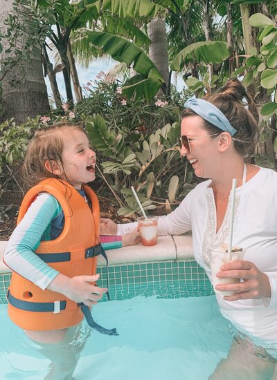 Jamie in a pool with her daughter