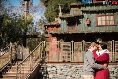 Engaged couple dance on the Mark Twain Steamboat at Disneyland