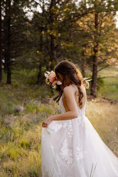 Bride in a field with bouquet