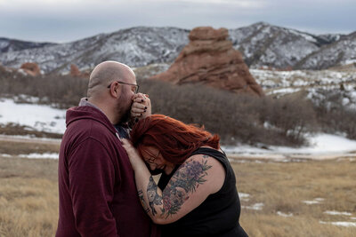 couple laughing in the mountains in denver colorado
