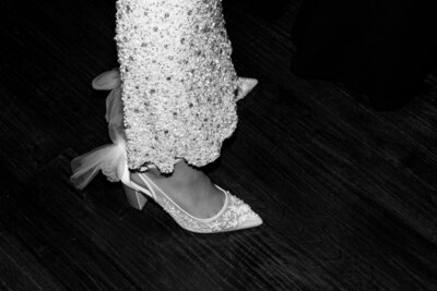 Close up of bride's shoes on dance flor